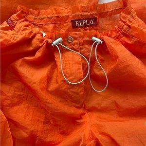 Reply parachute pants orange.